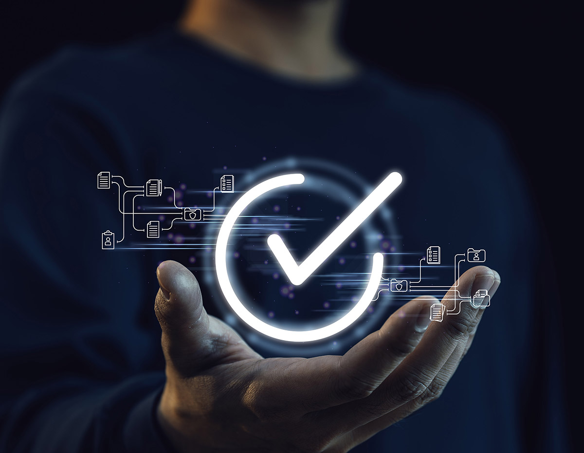 Open hand holding positive check mark for technology