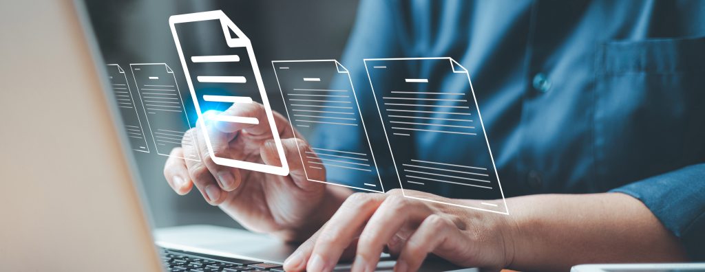 Conceptual image of person working on multiple documents.